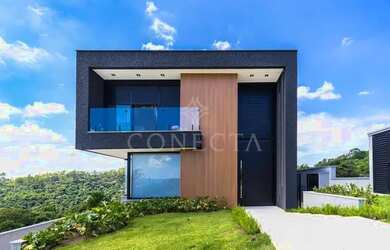 Imagem: A casa possui 4 Dormitórios, 5 Banheiros, 4 Vagas na garagem