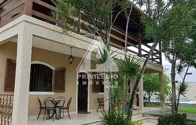 Imagem: A casa possui 5 Dormitórios, 5 Banheiros, 5 Vagas na garagem