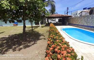 Imagem: A casa possui 3 Dormitórios, 4 Banheiros, 5 Vagas na garagem
