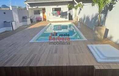 Imagem: A casa possui 3 Dormitórios, 2 Banheiros, 2 Vagas na garagem