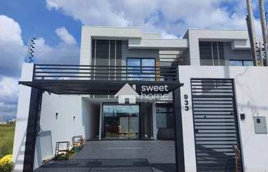 Imagem: A casa possui 3 Dormitórios, 3 Banheiros, 2 Vagas na garagem