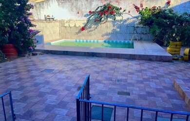 Imagem: A casa possui 3 Dormitórios, 3 Banheiros, 2 Vagas na garagem