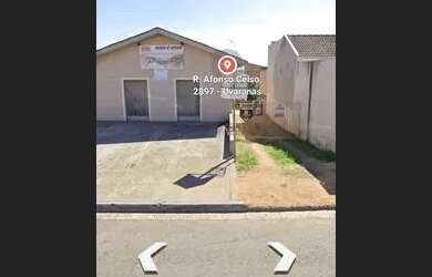 Imagem: A casa possui 3 Dormitórios, 3 Banheiros, 5 Vagas na garagem