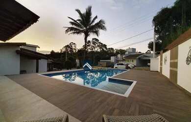 Imagem: A casa em condomínio possui 4 Dormitórios, 5 Banheiros, 4