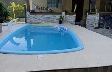 Imagem: A casa possui 4 Dormitórios, 3 Banheiros, 4 Vagas na garagem