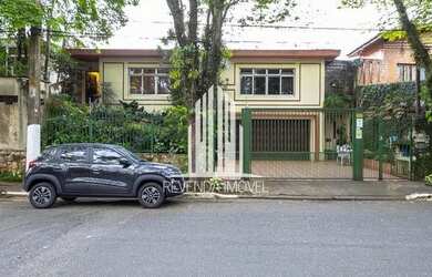 Imagem: A casa possui 3 Dormitórios, 4 Banheiros, 5 Vagas na garagem