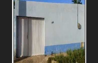 Imagem: A casa possui 2 Dormitórios, 1 Banheiro, 1 Vaga na garagem