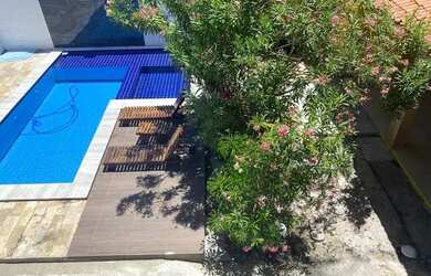 Imagem: A casa possui 4 Dormitórios, 3 Vagas na garagem e está localizado