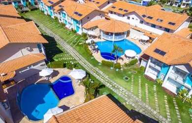 Imagem: A casa possui 2 Dormitórios e 1 Vaga na garagem e está localizado