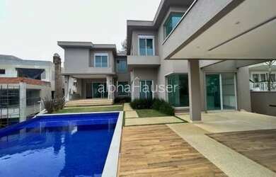 Imagem: A casa possui 5 Dormitórios, 5 Banheiros, 5 Vagas na garagem