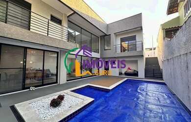 Imagem: A casa possui 4 Dormitórios, 5 Banheiros, 5 Vagas na garagem