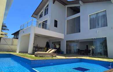 Imagem: A casa possui 4 Dormitórios, 5 Banheiros, 5 Vagas na garagem