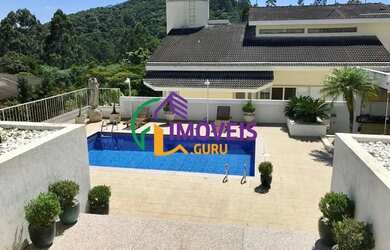 Imagem: A casa em condomínio possui 5 Dormitórios, 5 Banheiros, 5