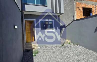 Imagem: A casa possui 3 Dormitórios, 2 Banheiros, 2 Vagas na garagem