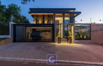 Imagem: A casa possui 3 Dormitórios, 5 Banheiros, 4 Vagas na garagem