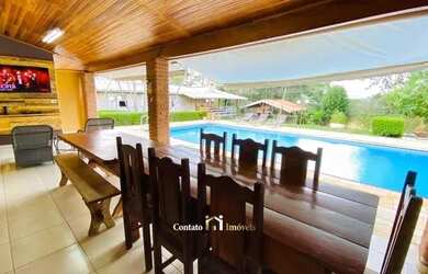 Imagem: A casa possui 5 Dormitórios, 2 Banheiros, 5 Vagas na garagem