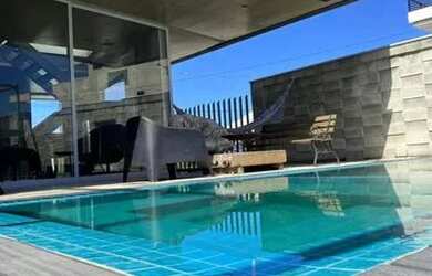 Imagem: A casa em condomínio para alugar possui 4 Dormitórios, 5 Banheiros