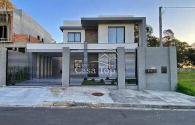 Imagem: A casa possui 3 Dormitórios, 3 Banheiros, 2 Vagas na garagem