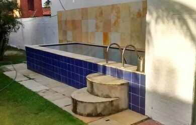 Imagem: A casa possui 5 Dormitórios, 4 Vagas na garagem e está localizado