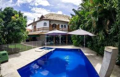 Imagem: A casa possui 5 Dormitórios, 5 Banheiros, 4 Vagas na garagem