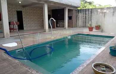 Imagem: A casa possui 5 Dormitórios, 4 Banheiros, 2 Vagas na garagem