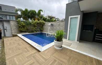 Imagem: A casa e possui 5 Dormitórios, Suítes, 5 Banheiros, 2 Vagas