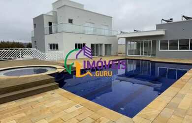 Imagem: A casa em condomínio possui 4 Dormitórios, 5 Banheiros, 5