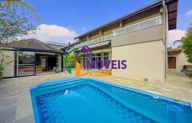 Imagem: A casa em condomínio possui 4 Dormitórios, 5 Banheiros, 5