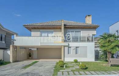 Imagem: A casa em condomínio possui 4 Dormitórios, 5 Banheiros, 4