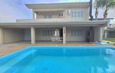 Imagem: A casa possui 5 Dormitórios, 4 Banheiros, 4 Vagas na garagem