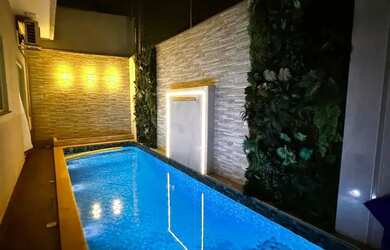 Imagem: A casa possui 3 Dormitórios, 2 Banheiros, 2 Vagas na garagem