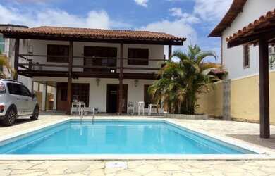 Imagem: A casa possui 4 Dormitórios, 4 Vagas na garagem e está localizado