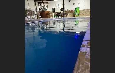 Imagem: A casa possui 5 Dormitórios, 5 Banheiros, 4 Vagas na garagem