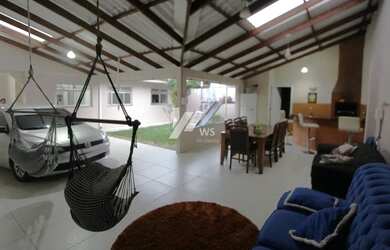 Imagem: A casa possui 3 Dormitórios, 4 Banheiros, 4 Vagas na garagem