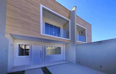 Imagem: A casa possui 3 Dormitórios, 2 Banheiros, 1 Vaga na garagem