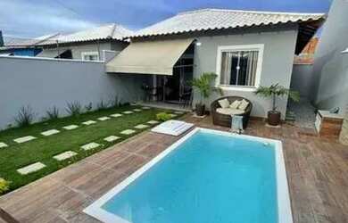 Imagem: A casa possui 3 Dormitórios, 2 Banheiros, 3 Vagas na garagem