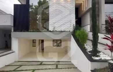 Imagem: A casa possui 3 Dormitórios, 5 Banheiros, 4 Vagas na garagem