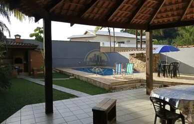 Imagem: A casa possui 3 Dormitórios, 5 Banheiros, 5 Vagas na garagem