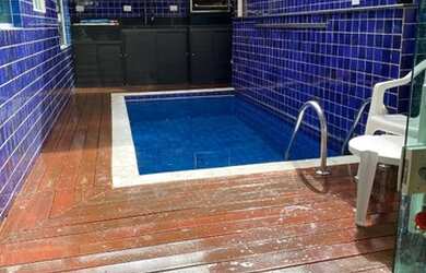 Imagem: A casa possui 3 Dormitórios, 2 Vagas na garagem e Churrasqueira