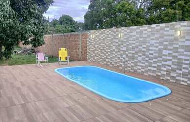 Imagem: A casa possui 2 Dormitórios, 3 Banheiros, 4 Vagas na garagem