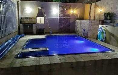 Imagem: A casa possui 4 Dormitórios, 3 Banheiros, 5 Vagas na garagem