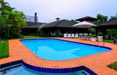 Imagem: A casa possui 5 Dormitórios, 5 Banheiros, 5 Vagas na garagem