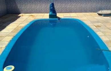 Imagem: A casa possui 2 Dormitórios, 4 Vagas na garagem, Churrasqueira