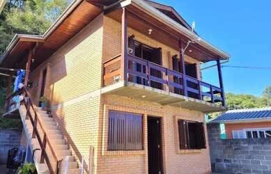 Imagem: A casa possui 2 Dormitórios, 1 Banheiro, 1 Vaga na garagem