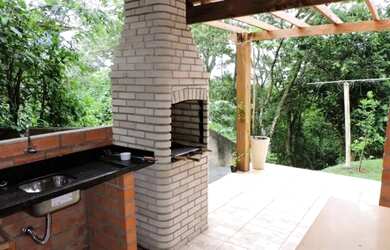 Imagem: A casa em condomínio possui 4 Dormitórios, 4 Banheiros, 3