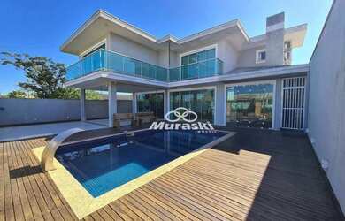 Imagem: A casa possui 3 Dormitórios, 3 Banheiros, 2 Vagas na garagem