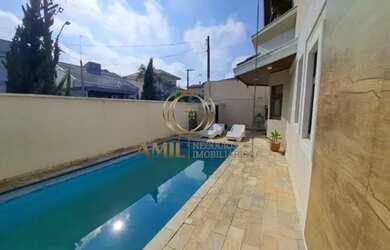 Imagem: A casa em condomínio possui 4 Dormitórios, 4 Banheiros, 2