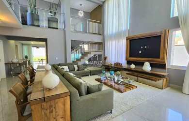 Imagem: A casa possui 5 Dormitórios, 4 Banheiros, 4 Vagas na garagem