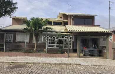 Imagem: A casa possui 3 Dormitórios, 3 Banheiros, 3 Vagas na garagem