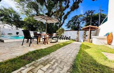 Imagem: A casa possui 5 Dormitórios, 1 Banheiro, 5 Vagas na garagem